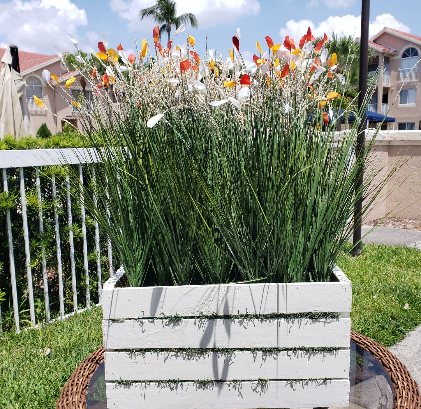 Wild field floral arrangement on a white wooden base (H:28", W:12.5", L:19")