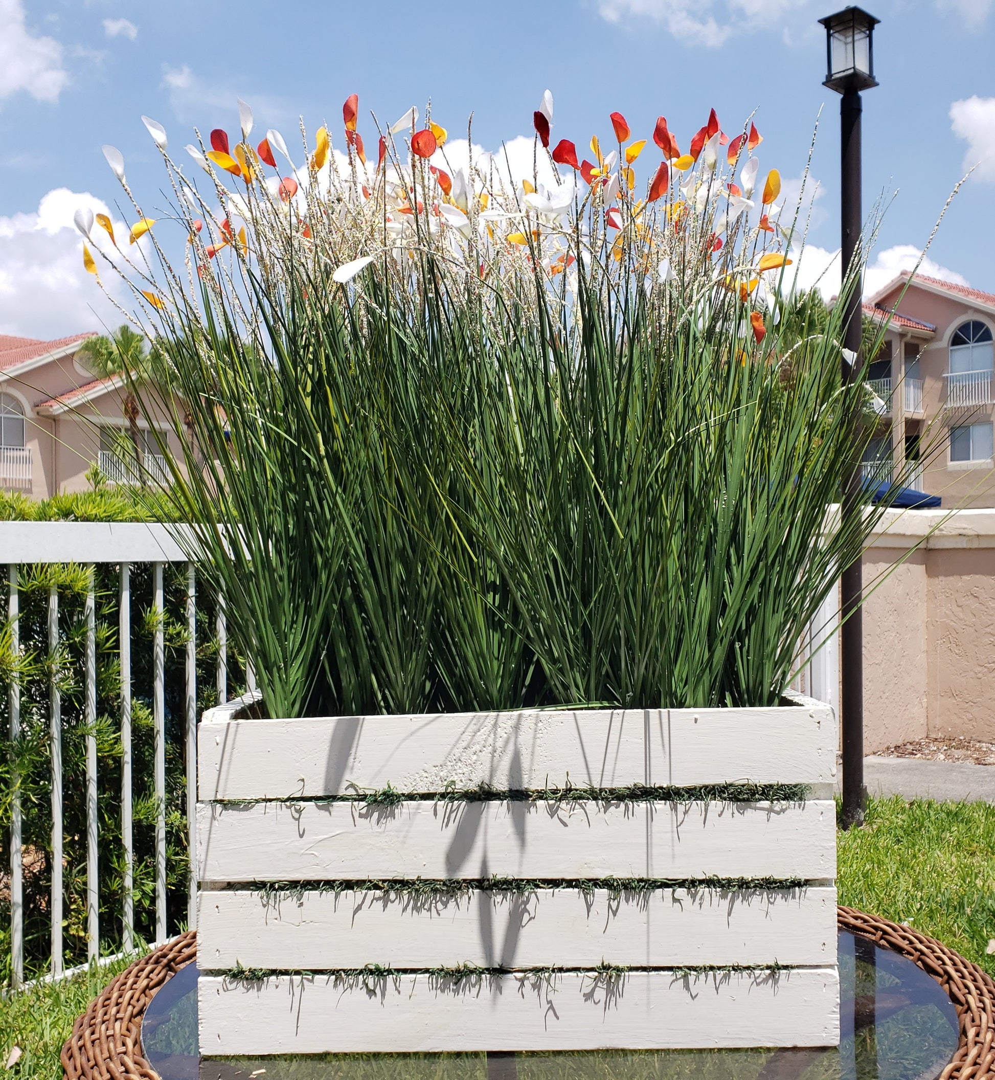 Wild field floral arrangement on a white wooden base (H:28", W:12.5", L:19")