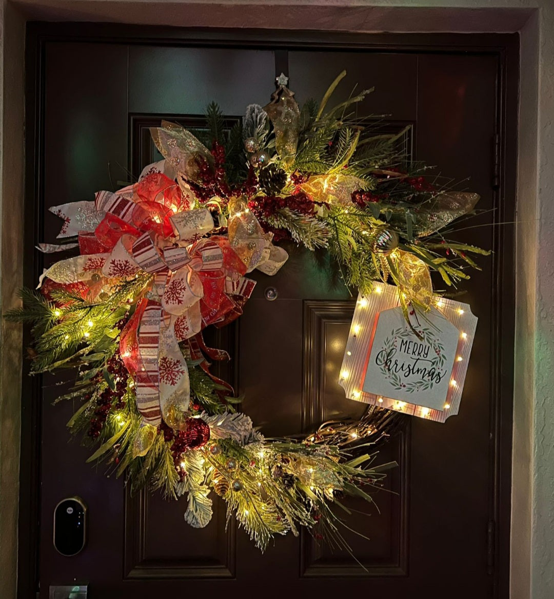 Christmas wreath with a message in a wood sign