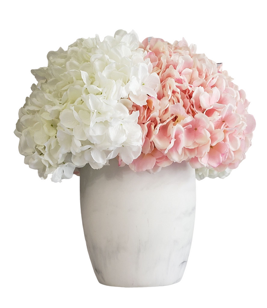 Soft and Exotic Floral arrangement with Pink and White Hydrangea in a White ceramic base. H: 17 In; Diam: 27 In